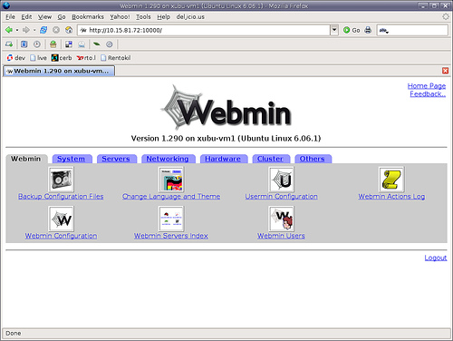 Captura de pantalla de Webmin con el menú principal. Bajo el logo de Webmin (una tela de araña pentagonal, con el texto webmin encima), se indica que es la Version 1.290 on xubu-vm1 (Ubuntu Linux 6.06.1). Debajo hay una serie de pestañas: Webmin (la seleccionada), System, Servers, Networking, Hardware, Cluster, Others. En la pstaña Webmin seleccionada, hay 7 iconos con 7 opciones seleccionables: Backup Configuration Files; Change Language and Theme;  Usermin Configuration; Webmin Actions Log; Webmin Configuration; Webmin Servers Index; Webmin Users.